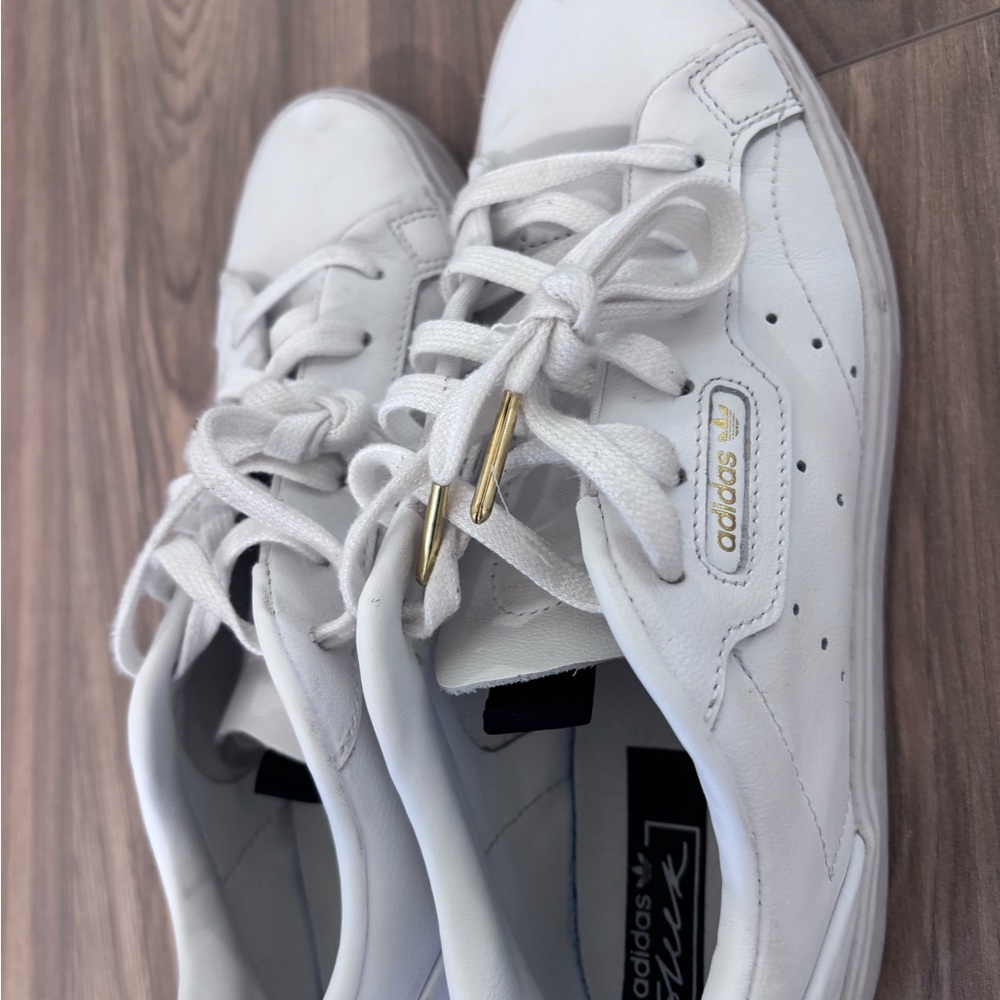 Adidas Sleek White Sneakers with Gold Details